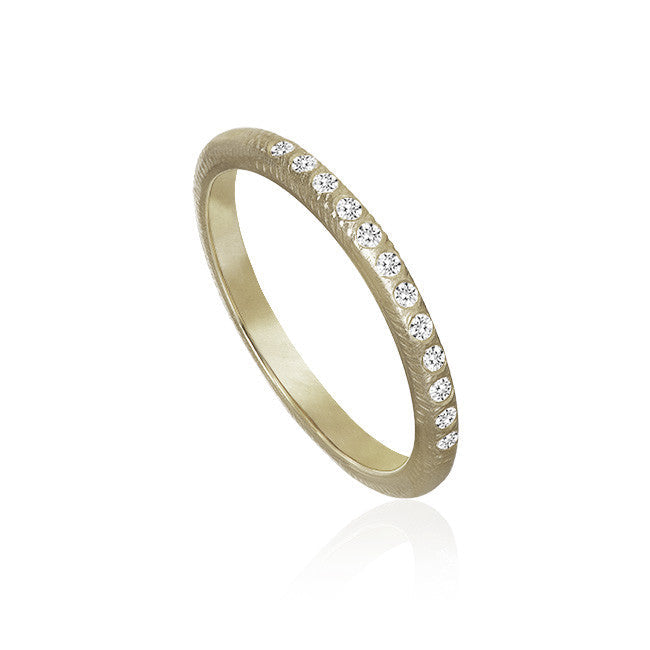 Curve ring med 12 brillanter fra Dulong Fine Jewelry. Hvidguld 18K.